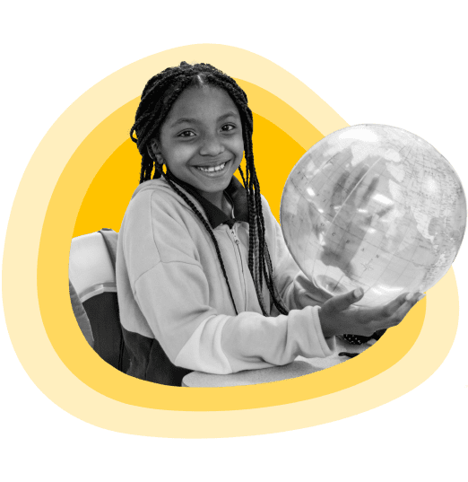 A young girl holding a transparent, inflatable globe